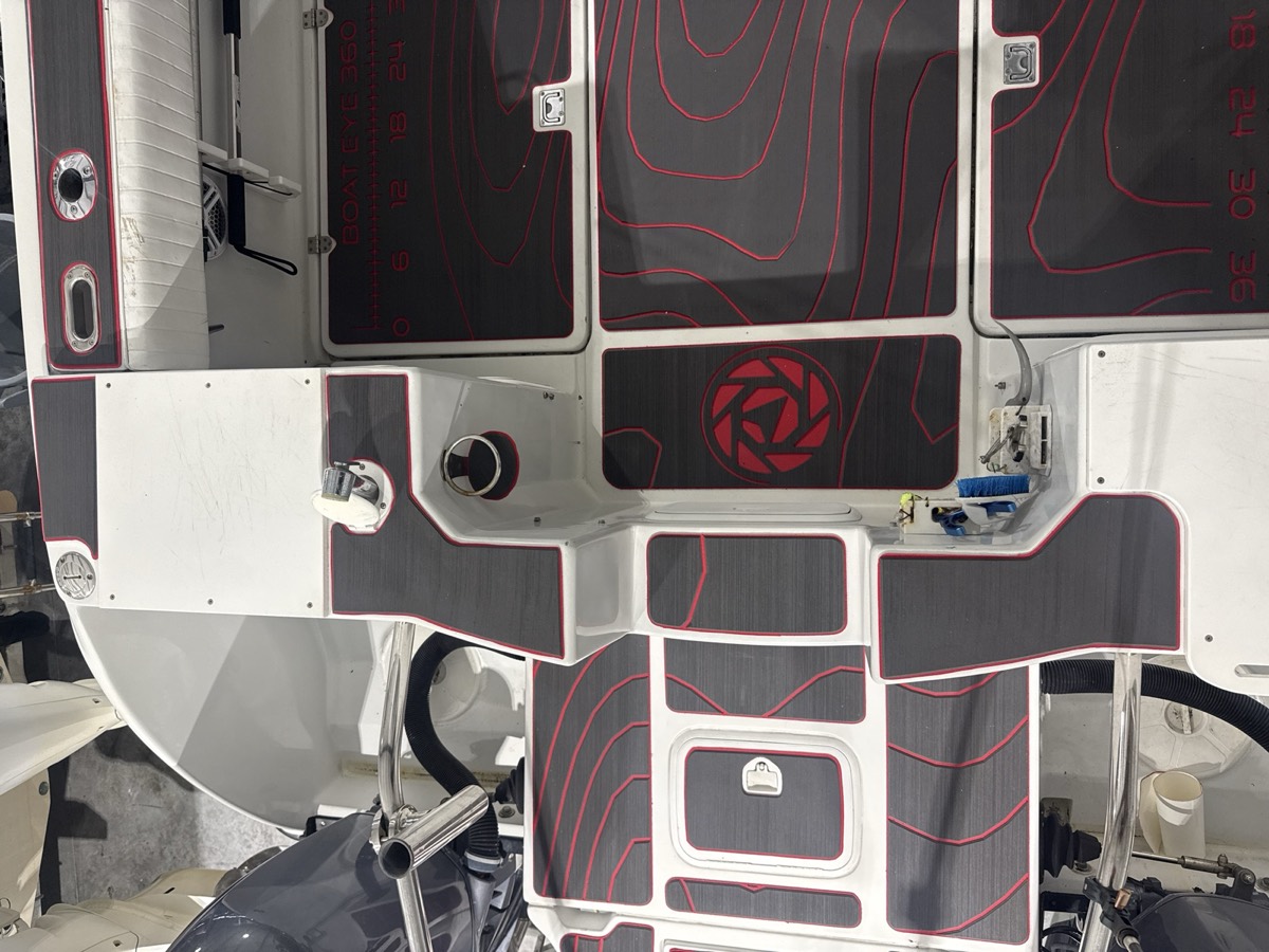 New custom marine decking with the Dynasty compass logo inlaid in the bow