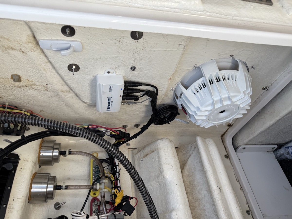 After: the same boat with the harness loomed, the module mounted and the speaker fitted