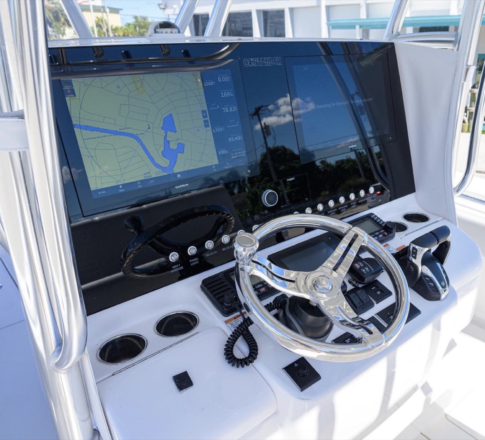 Wide glass helm with a large Garmin display, installed by Dynasty Marine Customs in Sarasota