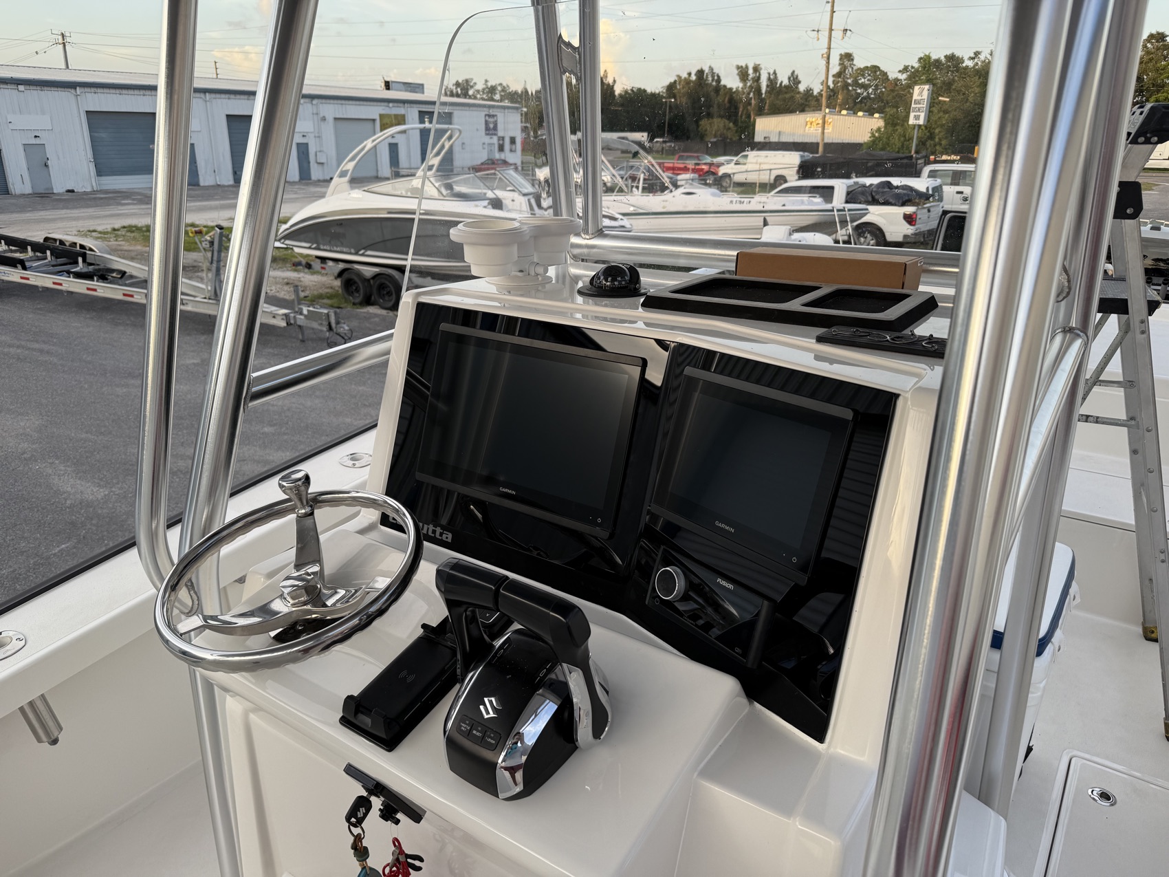 Refinished center console helm with new displays at dusk outside the Dynasty Marine Customs shop