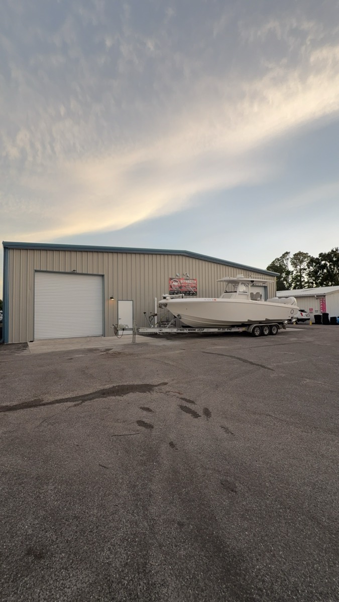 Finished center console on the trailer outside the Dynasty Marine Customs shop at dusk