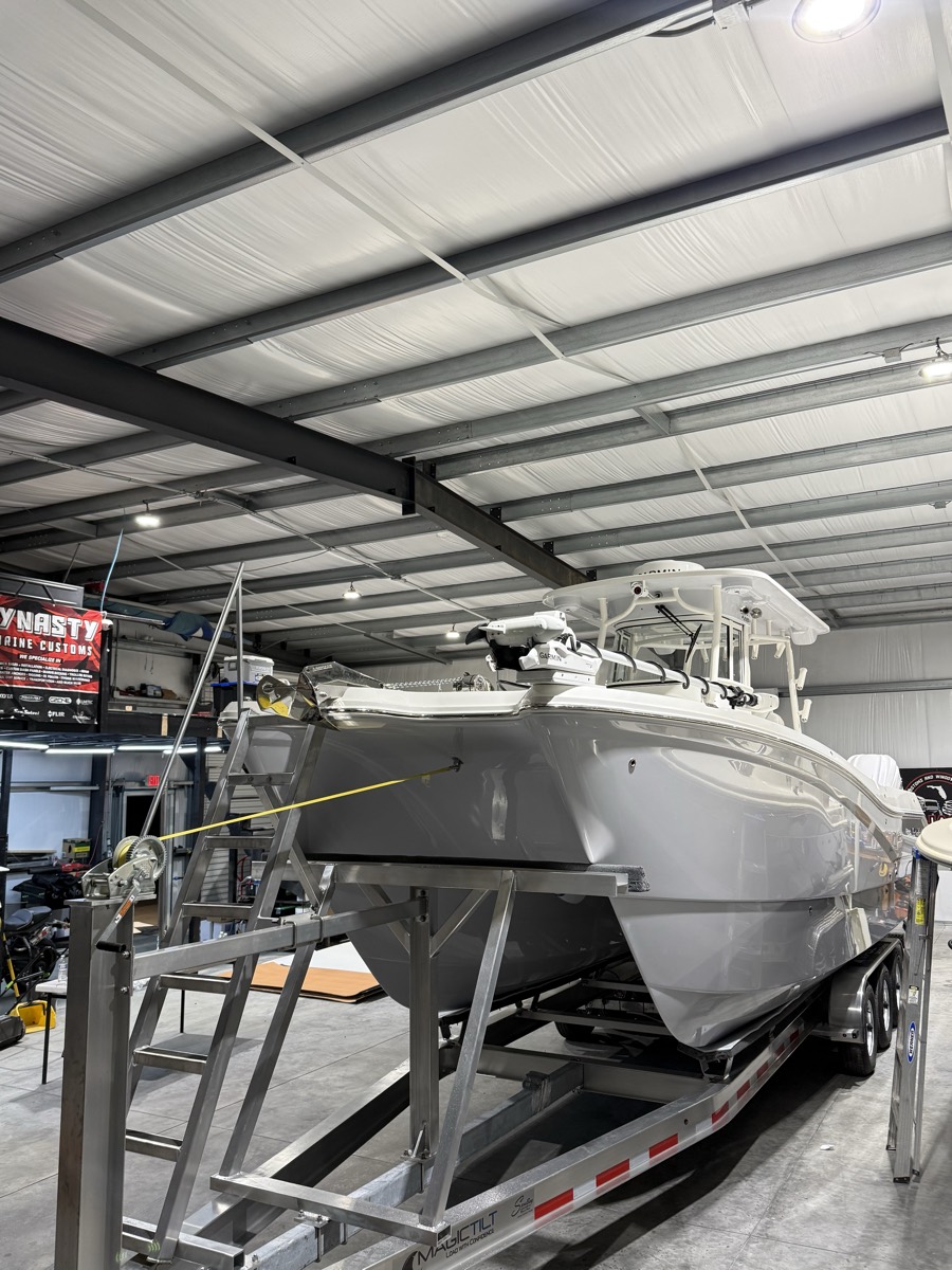 Center console up on stands inside the Dynasty Marine Customs shop during a refit