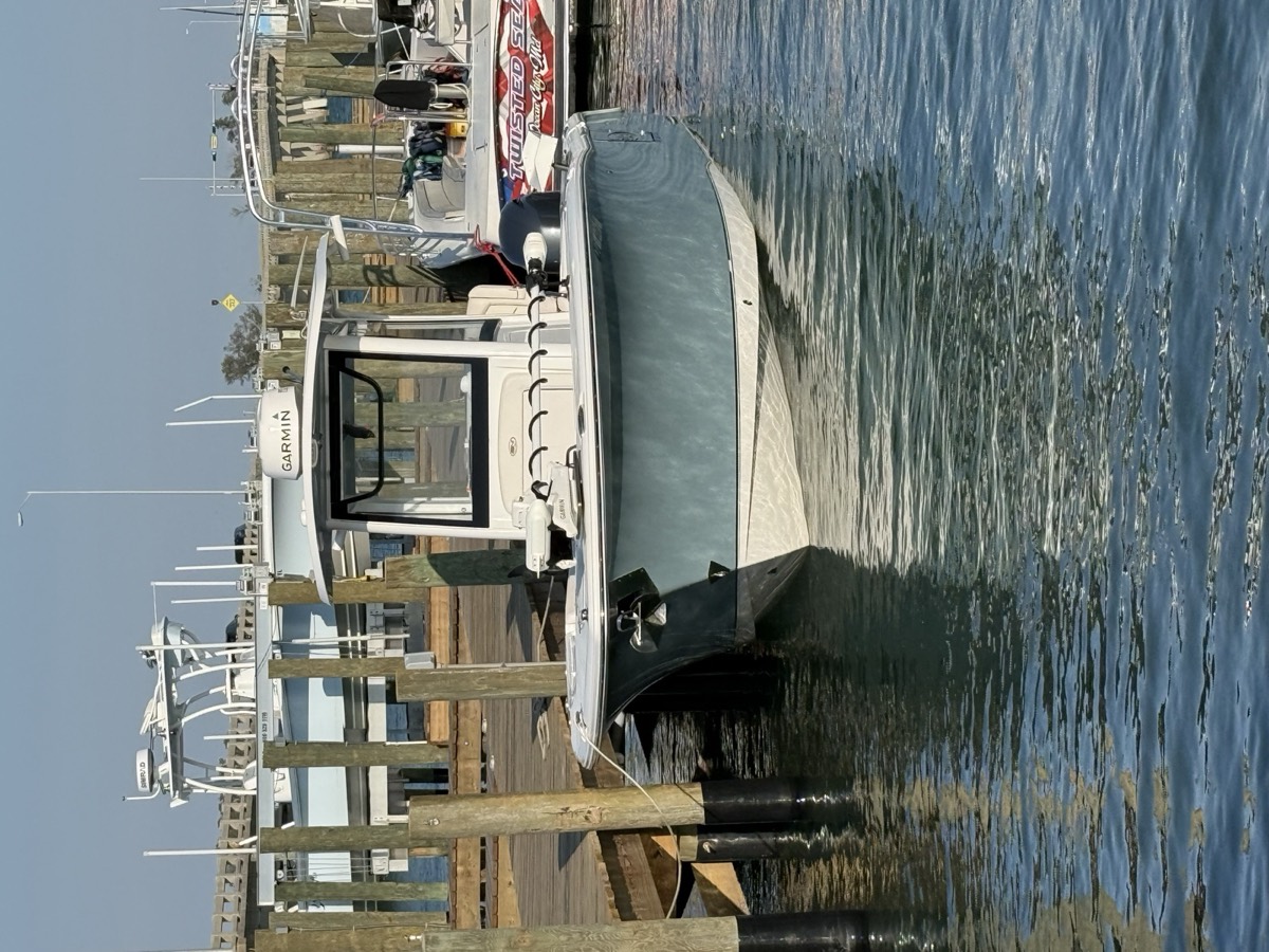Finished center console tied up at the dock after a Total Boat Control install