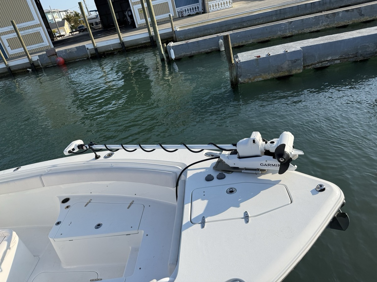 Garmin Force trolling motor mounted on the bow of a center console at the dock