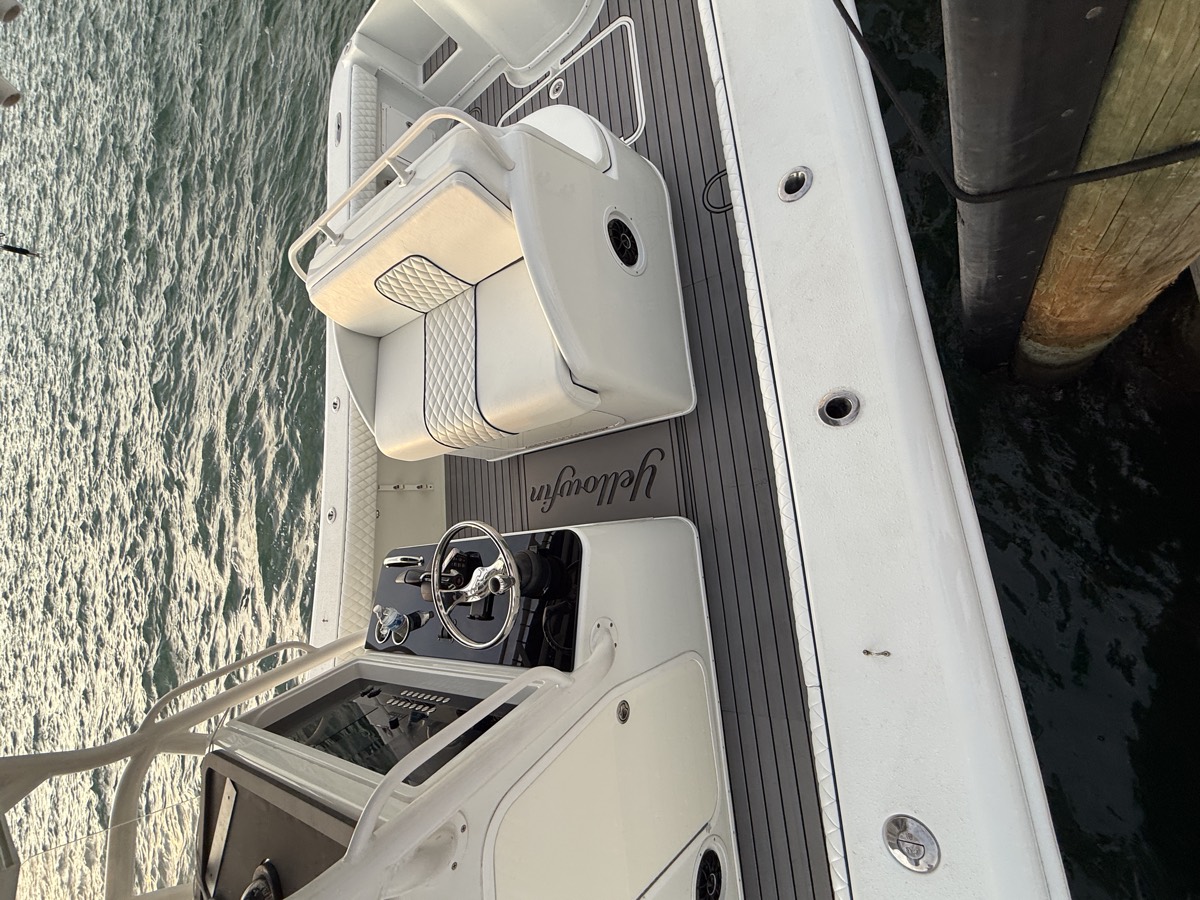 Leaning post and seating on a center console with fresh upholstery and decking